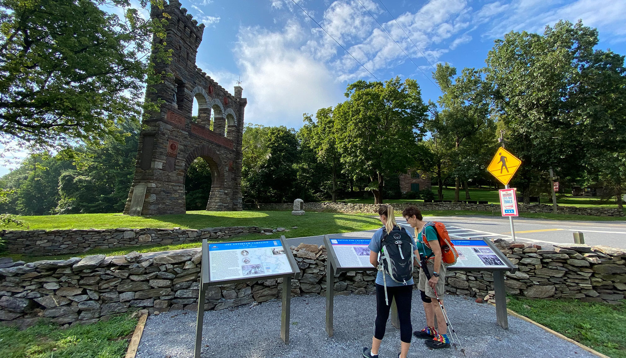Photograph of hikers at War Correspondents Memorial Arch