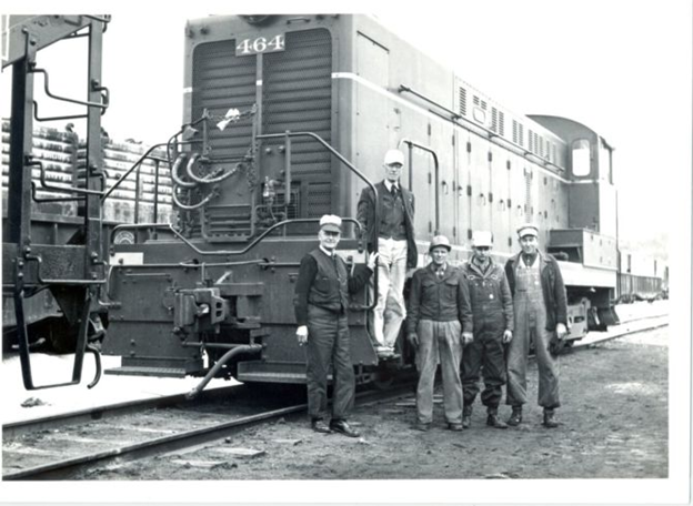 Railroad workers in Frederick standing in front of a train during the 1800s