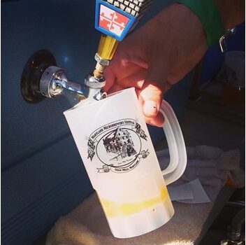 Photo of beverage being poured from a tap