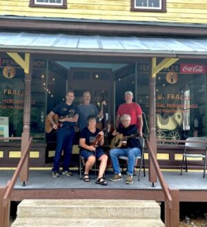 Image of musicians on the porch of the F.W. Fraley Store