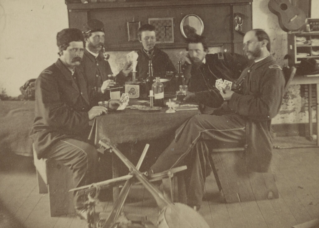Photograph of Civil War soldiers playing cards around a table